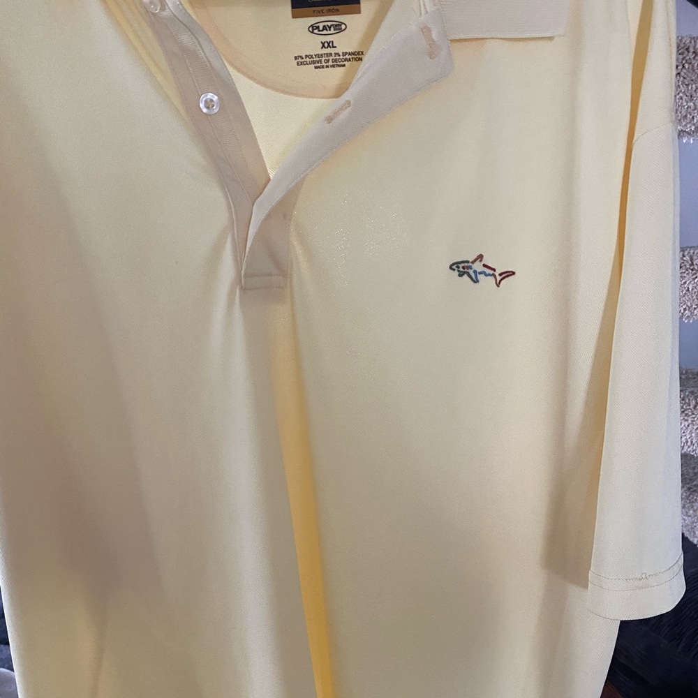Greg Norman polo shirt.